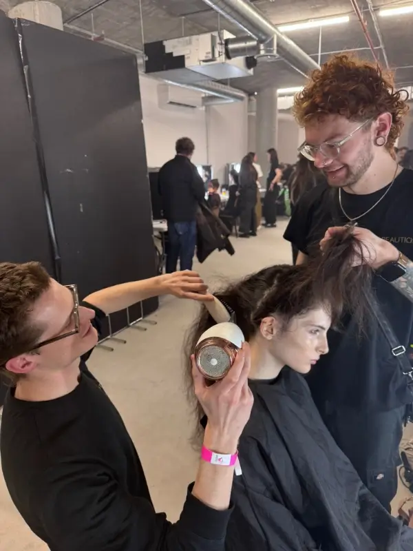 Dan Caines styling model's hair behind the scenes at London Fashion Week 2026