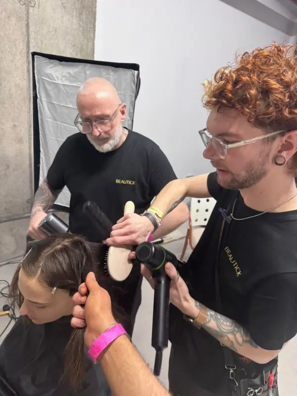 Dan Caines styling model's hair at London Fashion Week 2026