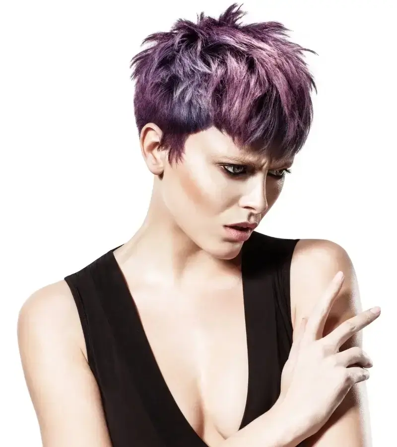Model featuring a textured pixie cut with deep purple and violet hair color, wearing a V-neck black top 2