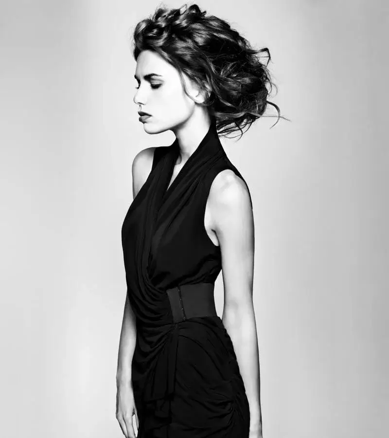 Profile shot of model showcasing voluminous textured waves updo created for Joseph Ferraro Hair ghd FAME Team
