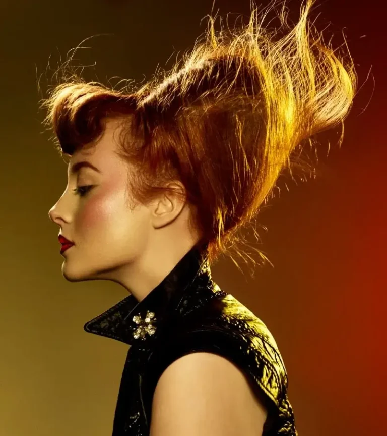Profile portrait of model with dramatic swept-up hair structure styled for Joseph Ferraro Hair Rebel Rebel BHA 2015