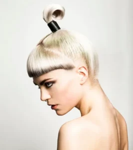 Platinum blonde avant-garde updo with blunt micro bangs from Joseph Ferraro Hair Modern Muse collection