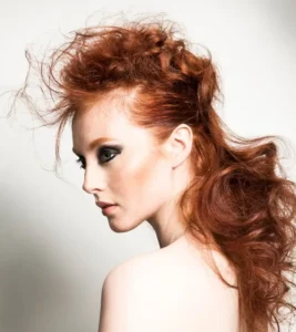 Voluminous copper-red textured updo with long waves, Modern Muse collection by Joseph Ferraro Hair