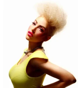 Model with voluminous spiky platinum blonde faux hawk hairstyle for Joseph Ferraro Hair BHA 2010